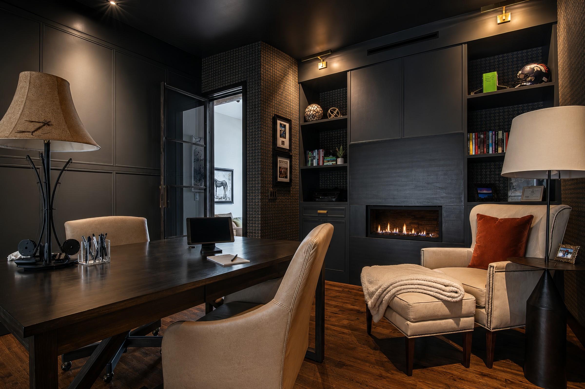 Home office and den with fireplace and built-in shelving