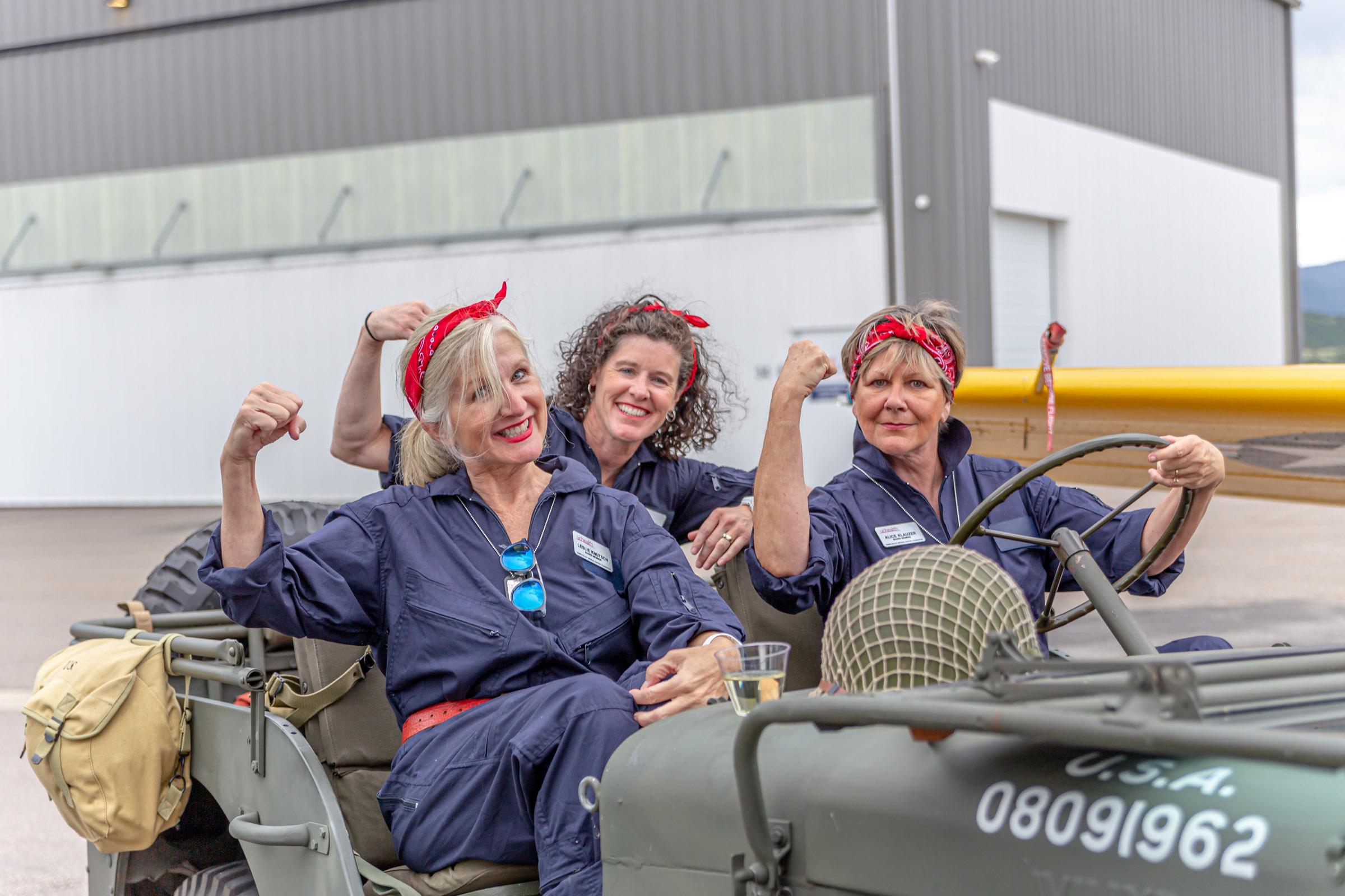 Guests in vintage costume at a hangar party event