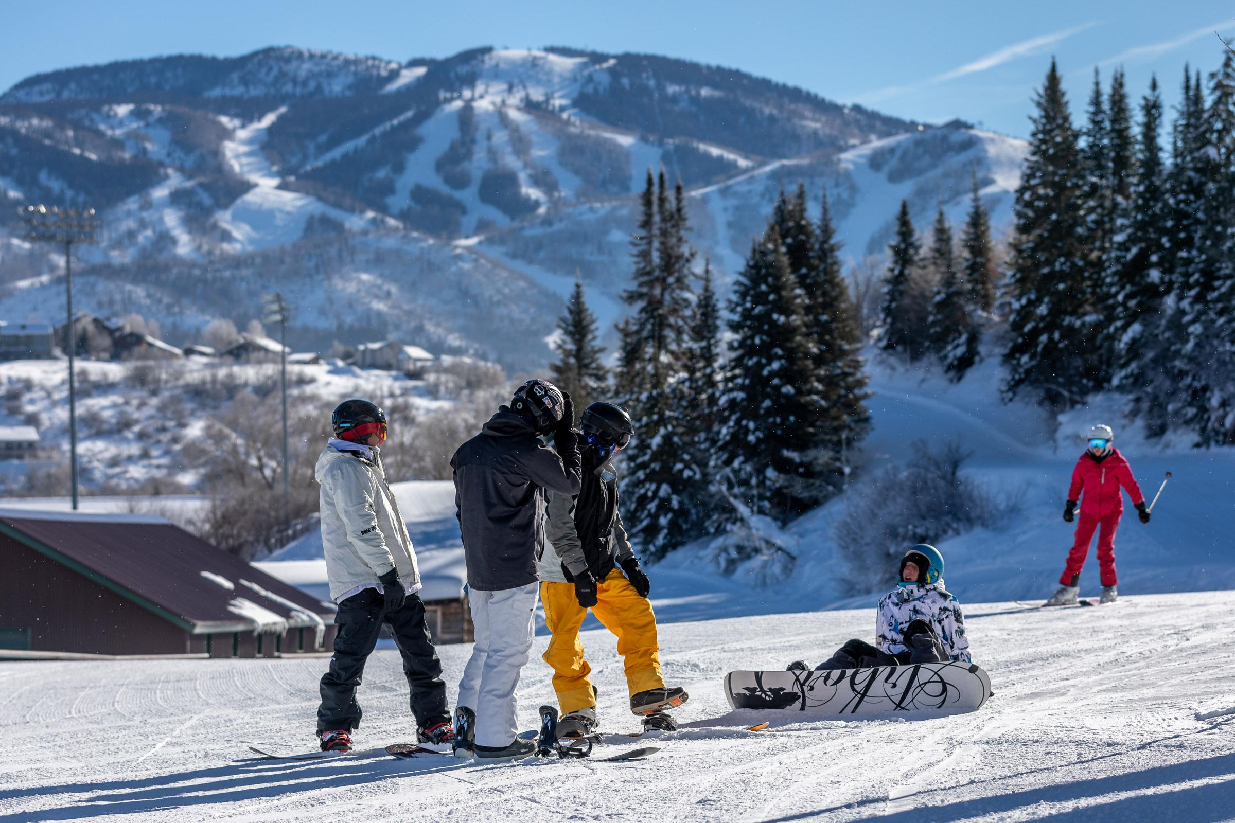 Snowboarders gathered at a ski resort on opening day